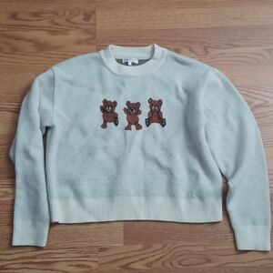 A bear decorated knitted sweater.